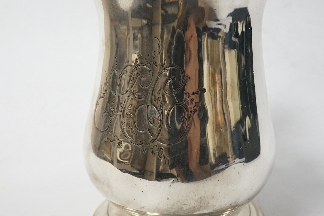 A late George II silver baluster pint mug, maker, ?B, London, 1759, with later engraved monogram(erasure), height 12cm, 13.8oz. Condition - poor to fair